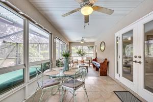 a dining room with a ceiling fan and a table and chairs at Dog-Friendly Home, Lake Henderson Across Street! in Inverness
