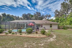 a house with a pool in the yard at Dog-Friendly Home, Lake Henderson Across Street! in Inverness