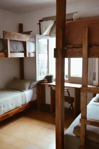 Postel nebo postele na pokoji v ubytování Hostel en Córdoba Capital con excelente ubicación y ambiente cuidado -Casa Revol- Barrio Güemes + 41 fotografií