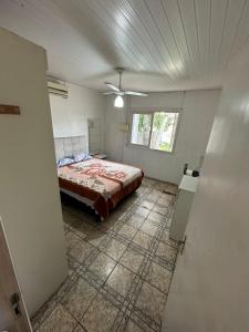 Ένα ή περισσότερα κρεβάτια σε δωμάτιο στο Casa na praia de Capão da Canoa