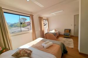 Ένα ή περισσότερα κρεβάτια σε δωμάτιο στο Família Costa-Studio Marie Curie (Inatel)