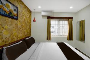 Postel nebo postele na pokoji v ubytování Hotel O The Pramaan