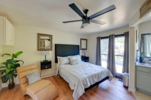 a bedroom with a bed and a ceiling fan at Close to Hospitals Peaceful Birmingham Studio in Wisteria Commons