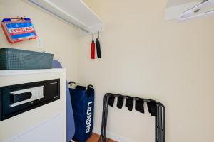 a kitchen with a microwave and a mirror on a wall at Close to Hospitals Peaceful Birmingham Studio in Wisteria Commons