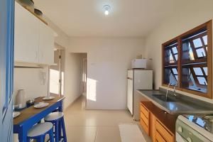 Kuchyň nebo kuchyňský kout v ubytování Casa Jardim das Palmeiras + 9 fotografií