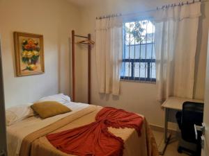 Postel nebo postele na pokoji v ubytování Casa Jardim das Palmeiras