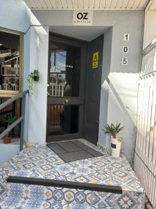 a front door of a building with a tile floor at Edificio Oz in Viña del Mar