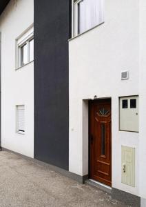 a door on the side of a white building at Old Town Maglaj 2, Center ,Parking in Maglaj