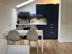 Kuchyň nebo kuchyňský kout v ubytování Flow Living I Zentrale Fewo mit schönem Bergblick