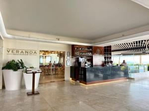 a lobby of a restaurant with a bar in it at Park Royal 809 Vista al Mar in Mazatlán +34 photos