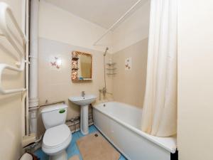 a bathroom with a toilet and a tub and a sink at Апартамент с восхитительным видом на горы и огни города in Almaty +21 photos