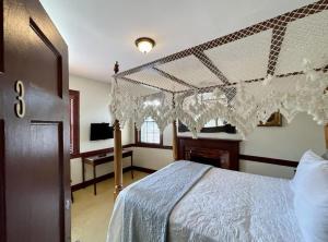 a bedroom with a bed with a white bedspread at Washington Hotel in Princess Anne