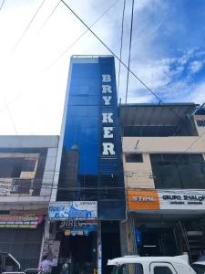 a building with a sign on the side of it at Hospedaje Bry Ker in Pichanaki