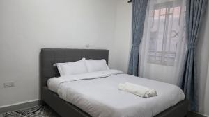 Postel nebo postele na pokoji v ubytování Marvel Homes - Pumzika