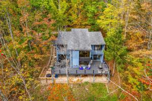 an aerial view of a house in the woods at Spacious 6 Bedroom Chalet Near Holiday Valley in Ellicottville
