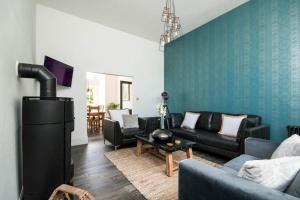 a living room with a couch and a fireplace at Firlands in Forres