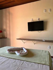Televisyen dan/atau pusat hiburan di Hotel Recanto Do Sol