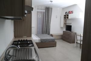 Η κουζίνα ή μικρή κουζίνα στο Giardino Eden B&B