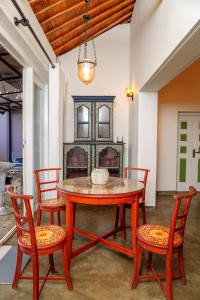 a dining room with a table and chairs at Exotica Bungalows -Hikkaduwa in Hikkaduwa