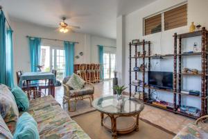 a living room with a couch and a table at View the Blue -Ground Level -Gold Standard Certified in Cayo Romero