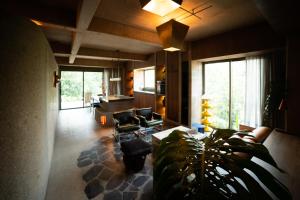 a living room with a couch and a plant at 23 Living in Medellín