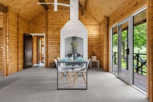 a dining room with a table and some chairs at The Wee Glen - Peaceful Country Retreat 2 bed in Bennetts