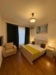Ένα ή περισσότερα κρεβάτια σε δωμάτιο στο Aldemar Apart Hotel