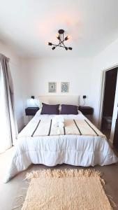 Postel nebo postele na pokoji v ubytování ApartStudios cerca de Ezeiza AGC + 9 fotografií