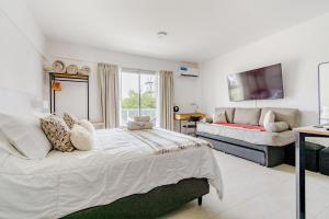 Ένα ή περισσότερα κρεβάτια σε δωμάτιο στο Departamento Aeropuerto Ezeiza +20 φωτογραφίες