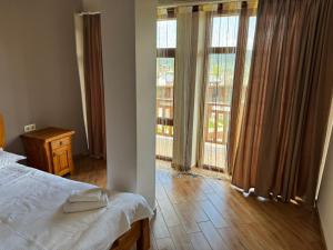 Ένα ή περισσότερα κρεβάτια σε δωμάτιο στο Hotel Sachino