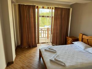 Ένα ή περισσότερα κρεβάτια σε δωμάτιο στο Hotel Sachino