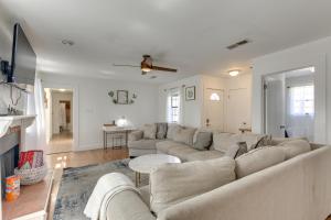 a living room with a couch and a table at 2 Mi to University and Long Beach Harbor Family Gem in Long Beach