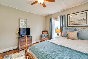 a bedroom with a bed and a tv on a dresser at Rock Climb, Hike, Relax! Quiet Beattyville Retreat in Beattyville