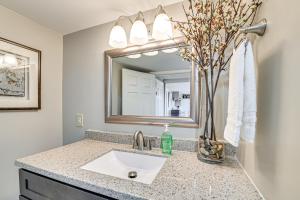 a bathroom with a sink and a mirror at Rock Climb, Hike, Relax! Quiet Beattyville Retreat in Beattyville +18 photos