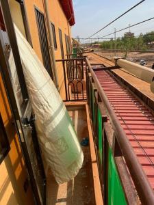 a mattress is on the side of a train at Résidence socorez in Ouagadougou