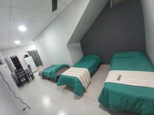 Ένα ή περισσότερα κρεβάτια σε δωμάτιο στο El Amanecer