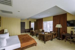 Postel nebo postele na pokoji v ubytování Stella Residence Club
