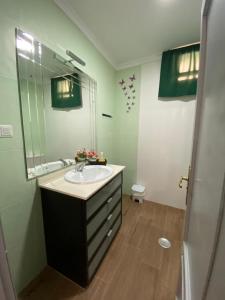 a bathroom with a sink and a mirror at Casa Rural Maria in Pinos Genil +38 photos
