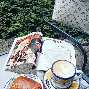 a book and a cup of coffee and some bread at Depa Ideal in San Miguel de Allende