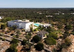 an aerial view of a building with a pool at Villa San Vito Due in Ostuni