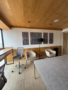 an office with chairs and a table in a room at Casa Colon Reforma in Mexico City +16 photos
