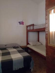 Postel nebo postele na pokoji v ubytování La Morada de Dois Peixes + 23 fotografií