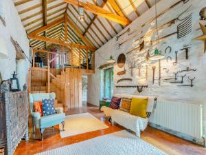 a living room with two chairs and a couch at Upper House - Uk48805 in Hereford