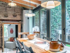 a dining room with a wooden table and chairs at Upper House - Uk48805 in Hereford +16 photos