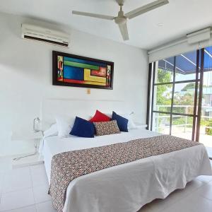 Ένα ή περισσότερα κρεβάτια σε δωμάτιο στο Casa Descanso Peñon