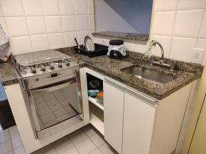 Η κουζίνα ή μικρή κουζίνα στο Apartamento 3 dormitórios Granja Viana +9 φωτογραφίες