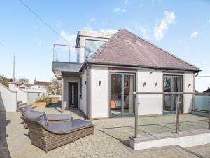 a house with a glass roof and a patio at Blodfryn in Llandudno Junction