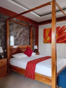 a bedroom with two bunk beds with white sheets at Casa Green Kori in Kerobokan
