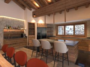 Η κουζίνα ή μικρή κουζίνα στο Chalet d'exception aux 3 Vallées, 14 pers, jacuzzi, sauna - FR-1-452-399
