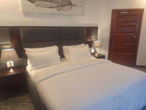 Postel nebo postele na pokoji v ubytování Makupula Apartments + 5 fotografií